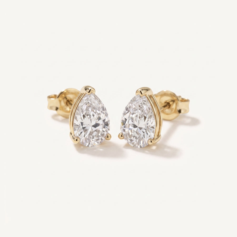 Leah's Tear pear diamond solitaire studs in 14k gold
