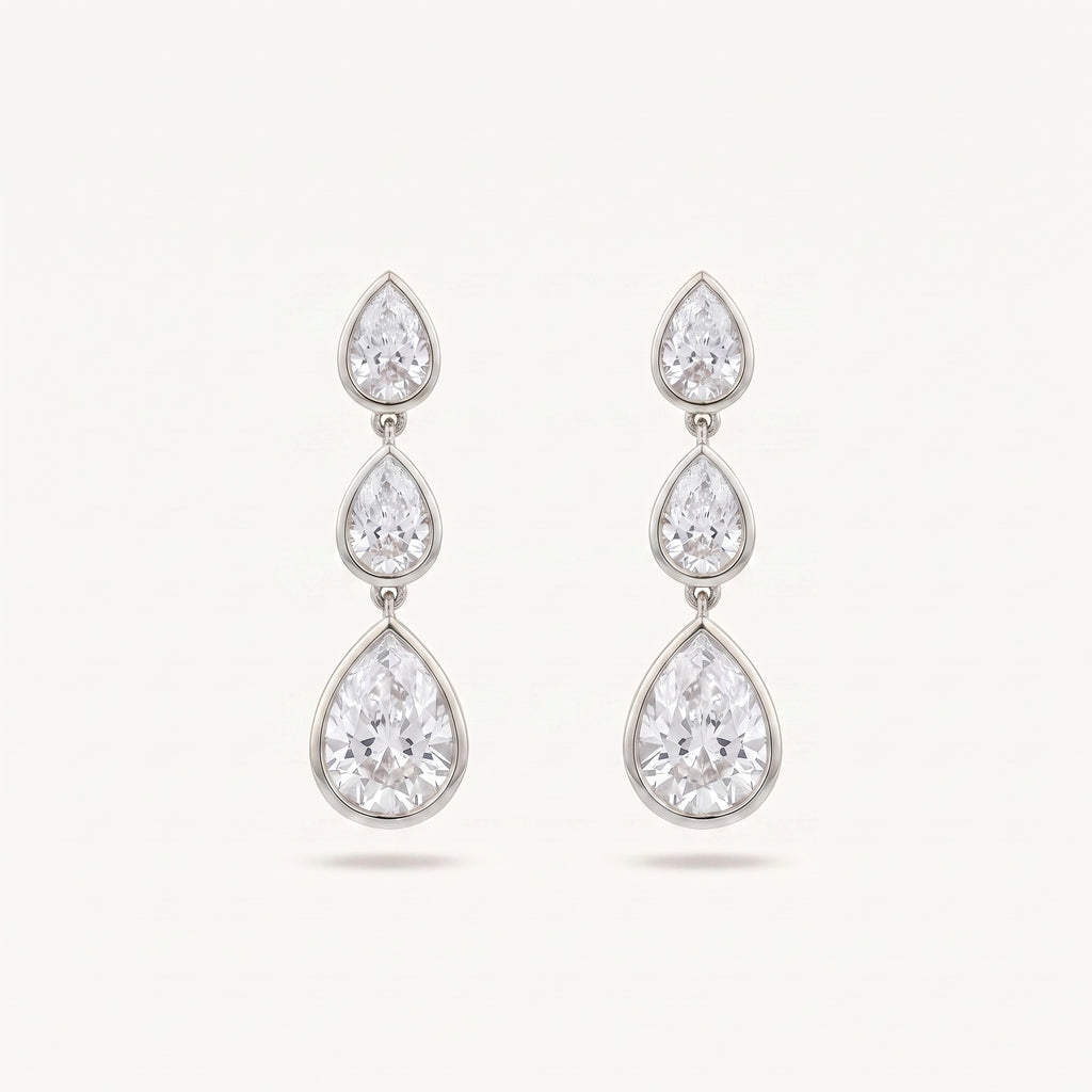 Graduated Pear Diamond Drop Earrings bezel-set pears in white gold