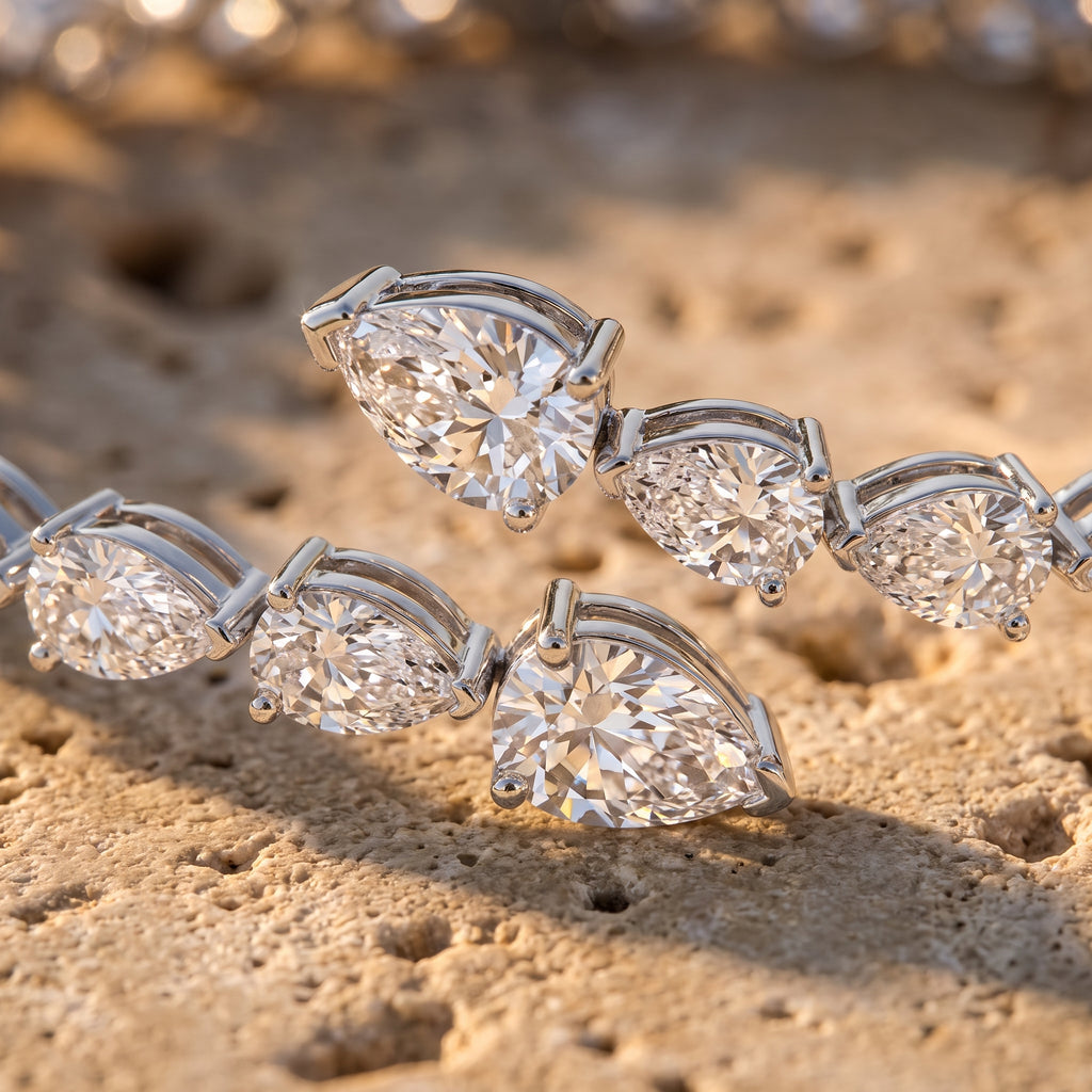 Leah's Bangle macro detail showing overlapping pear-cut diamonds in three-prong settings