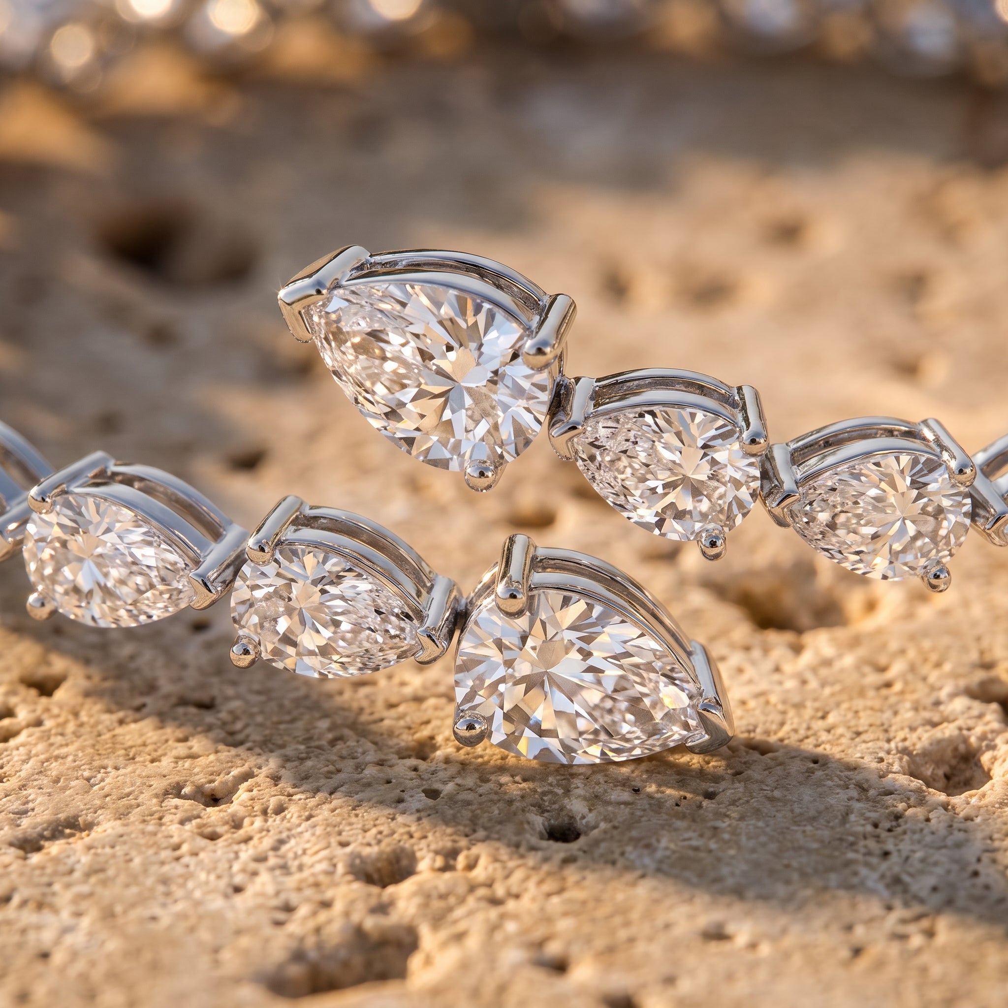Leah's Bangle macro detail showing overlapping pear-cut diamonds in three-prong settings