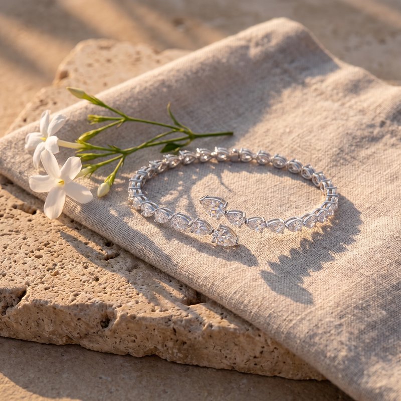Leah's Bangle on raw linen and Jerusalem stone with jasmine in late afternoon light