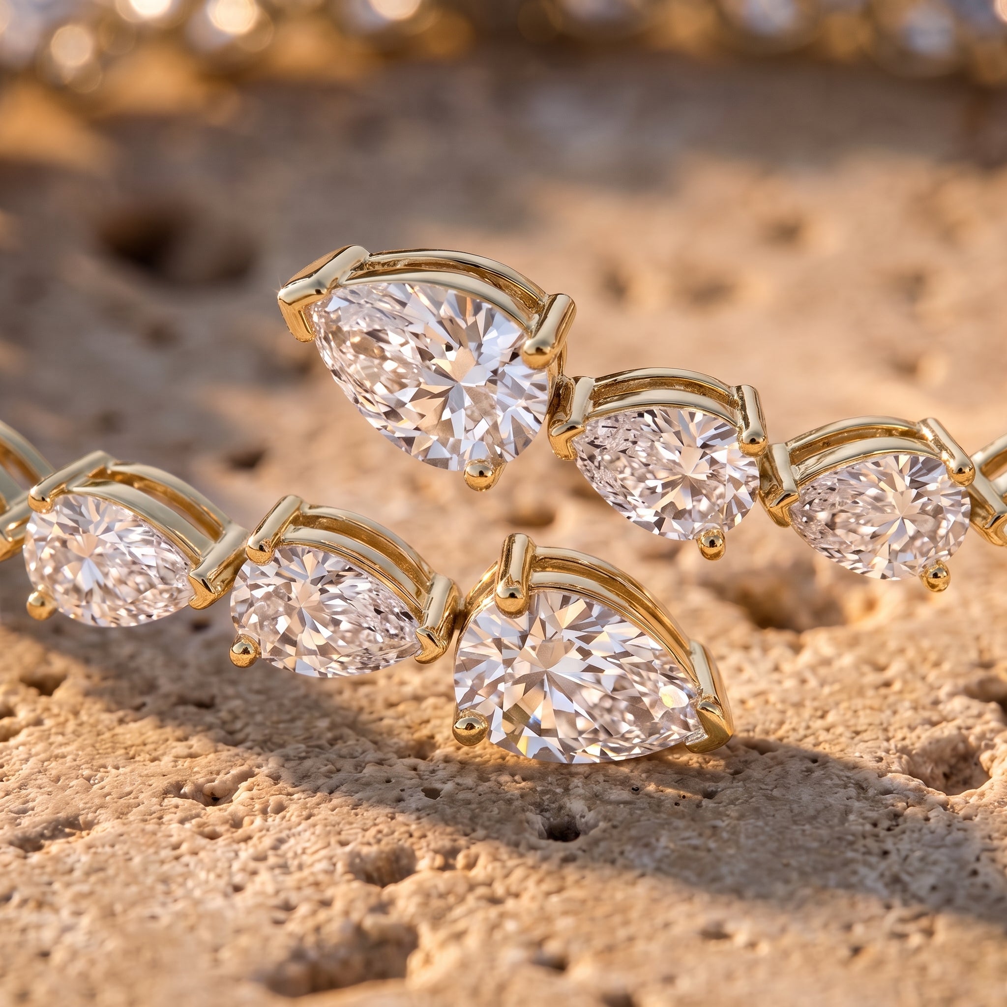 Leah's Bangle macro detail in 14k yellow gold showing overlapping pear-cut diamonds