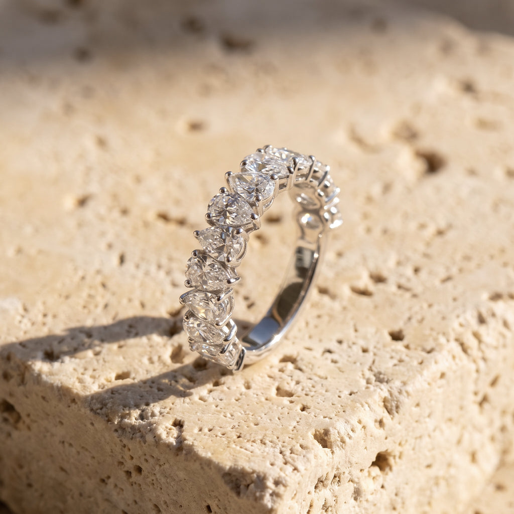 Rachel's Ring alternating pear half-eternity band in 14k white gold on raw Jerusalem stone