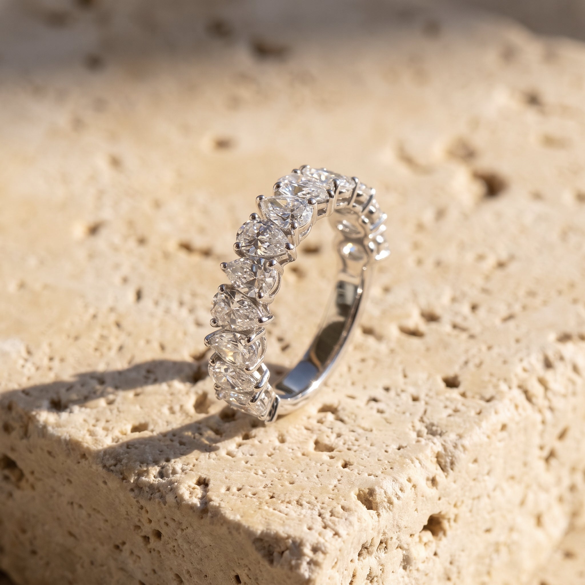 Rachel's Ring alternating pear half-eternity band in 14k white gold on raw Jerusalem stone