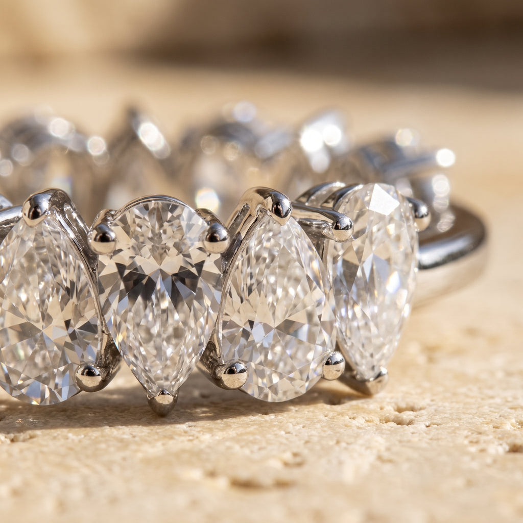 Macro detail of Rachel's Ring: zigzag alternating pear diamonds in shared-prong white gold