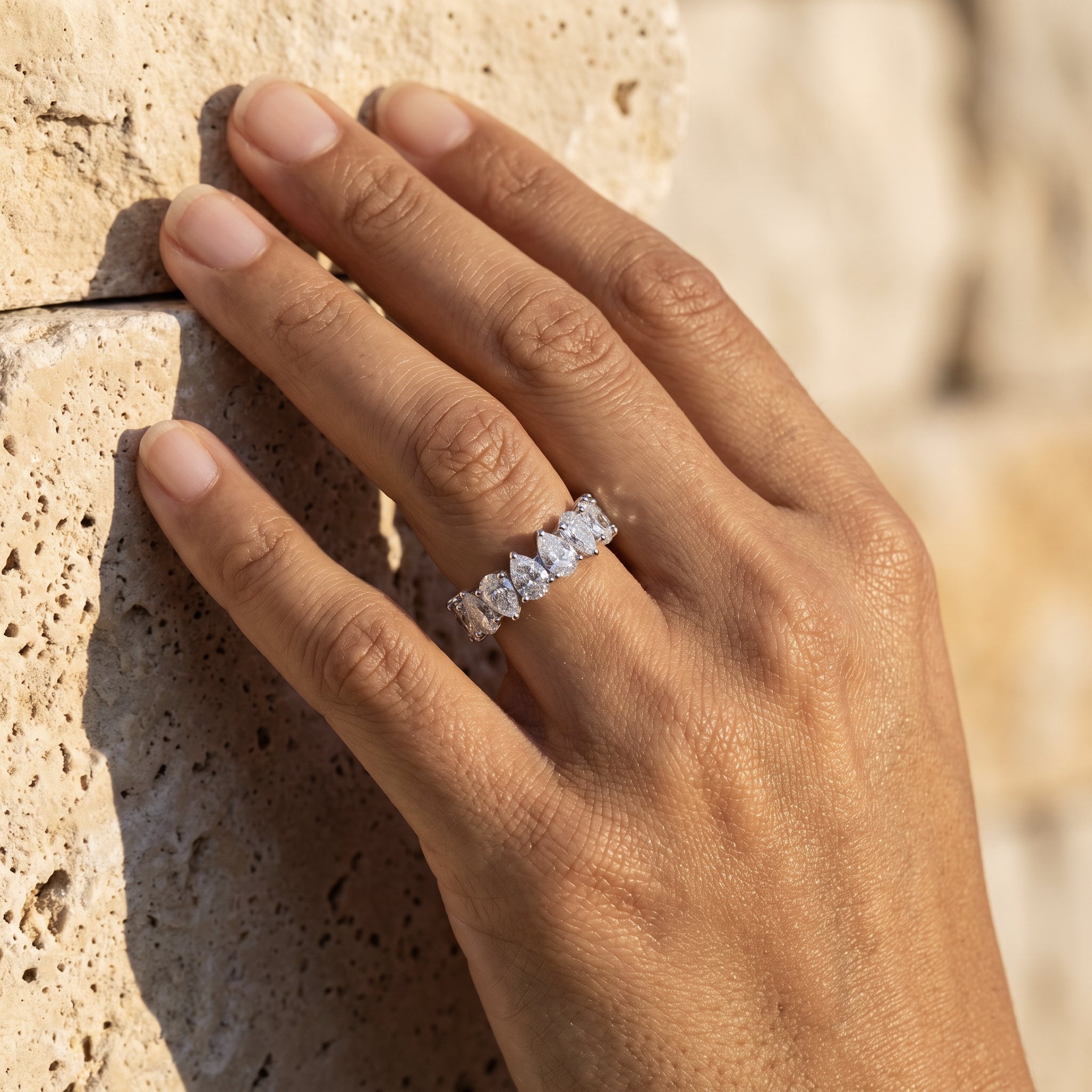 Rachel's Ring half-eternity band worn on the hand at true size 6 scale
