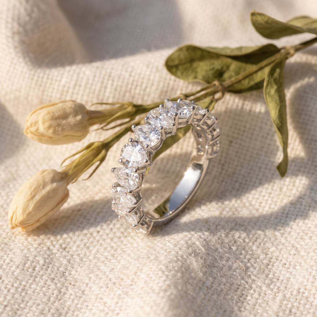 Rachel's Ring on oatmeal linen with dried tulip buds and olive leaves