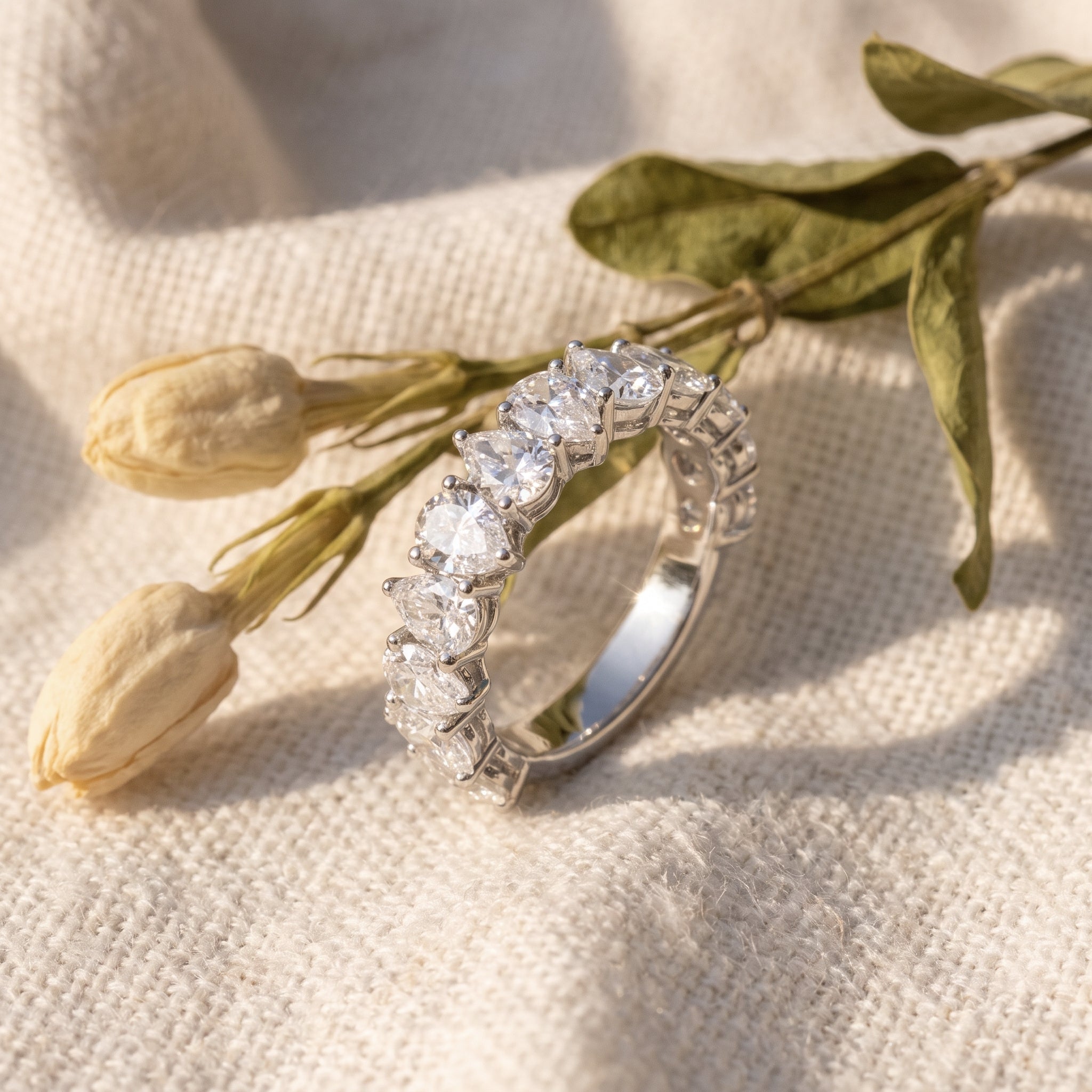 Rachel's Ring on oatmeal linen with dried tulip buds and olive leaves