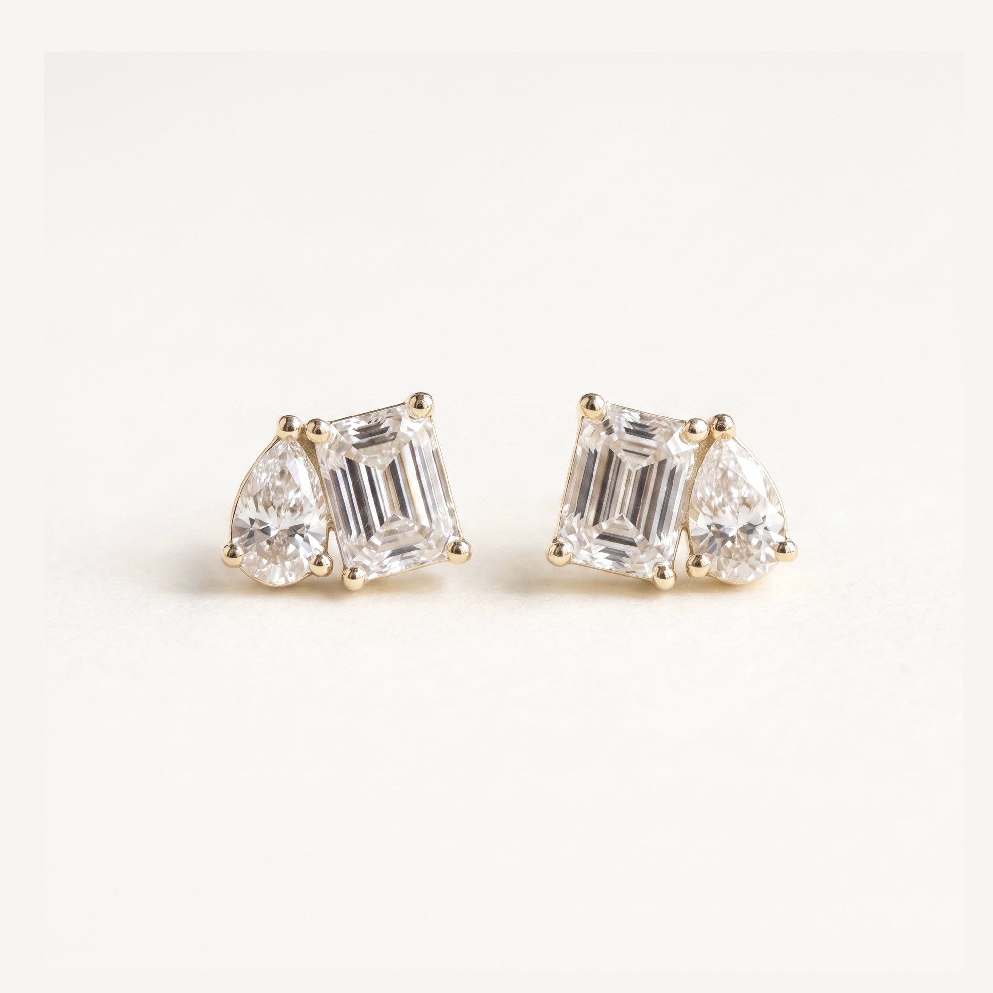 Rachel's Vow pear and emerald cut toi-et-moi diamond studs in 14k gold
