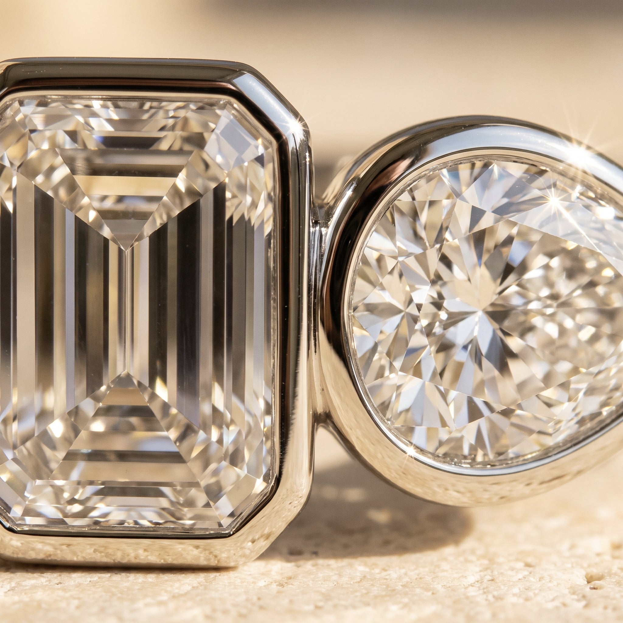 Macro detail of Rachel's Vow Ring: step-cut emerald facets and pear brilliance meeting at the touching bezels