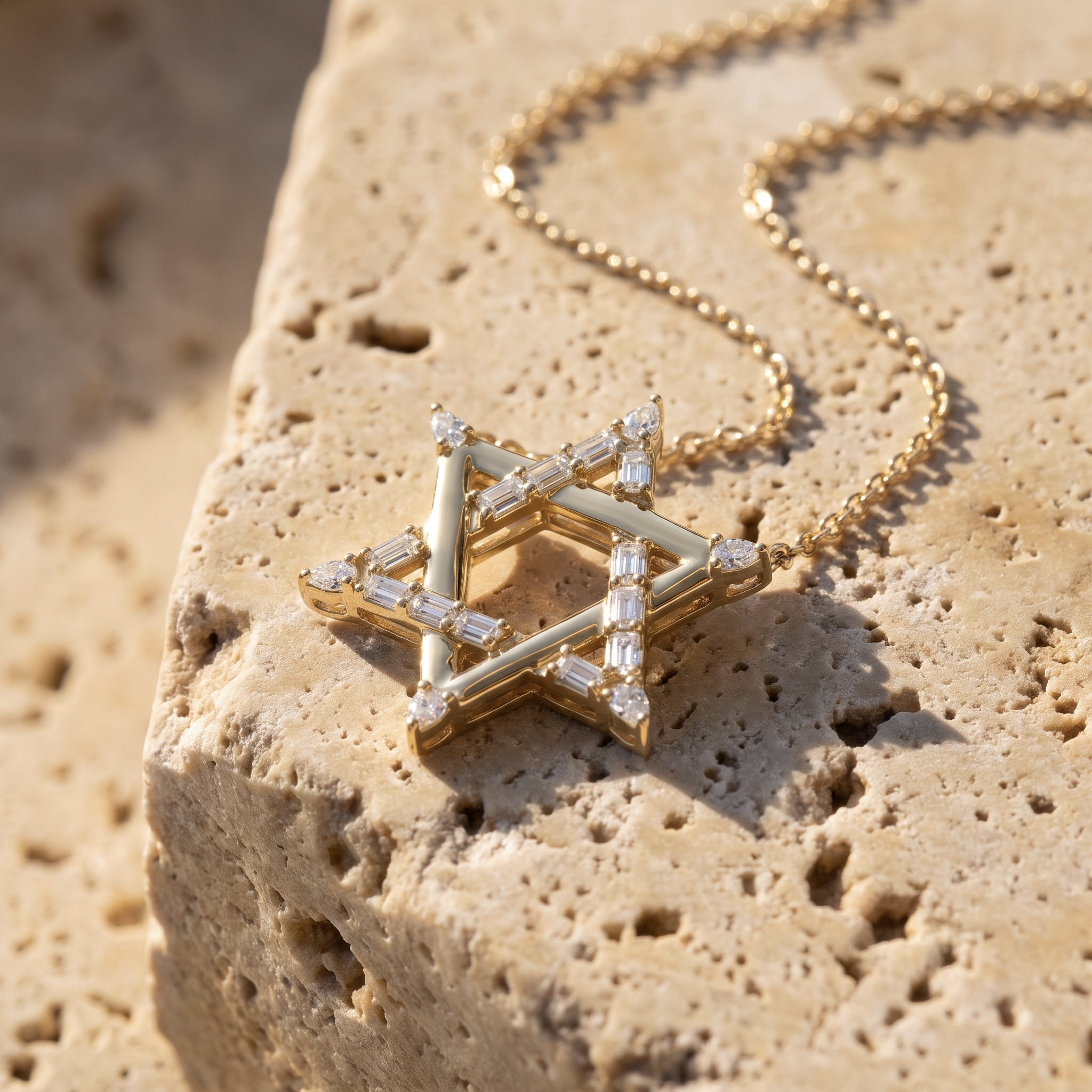 Sarah's Shield Magen David diamond pendant in 14k yellow gold, baguette-set bars with pear-cut tips, on raw Jerusalem stone