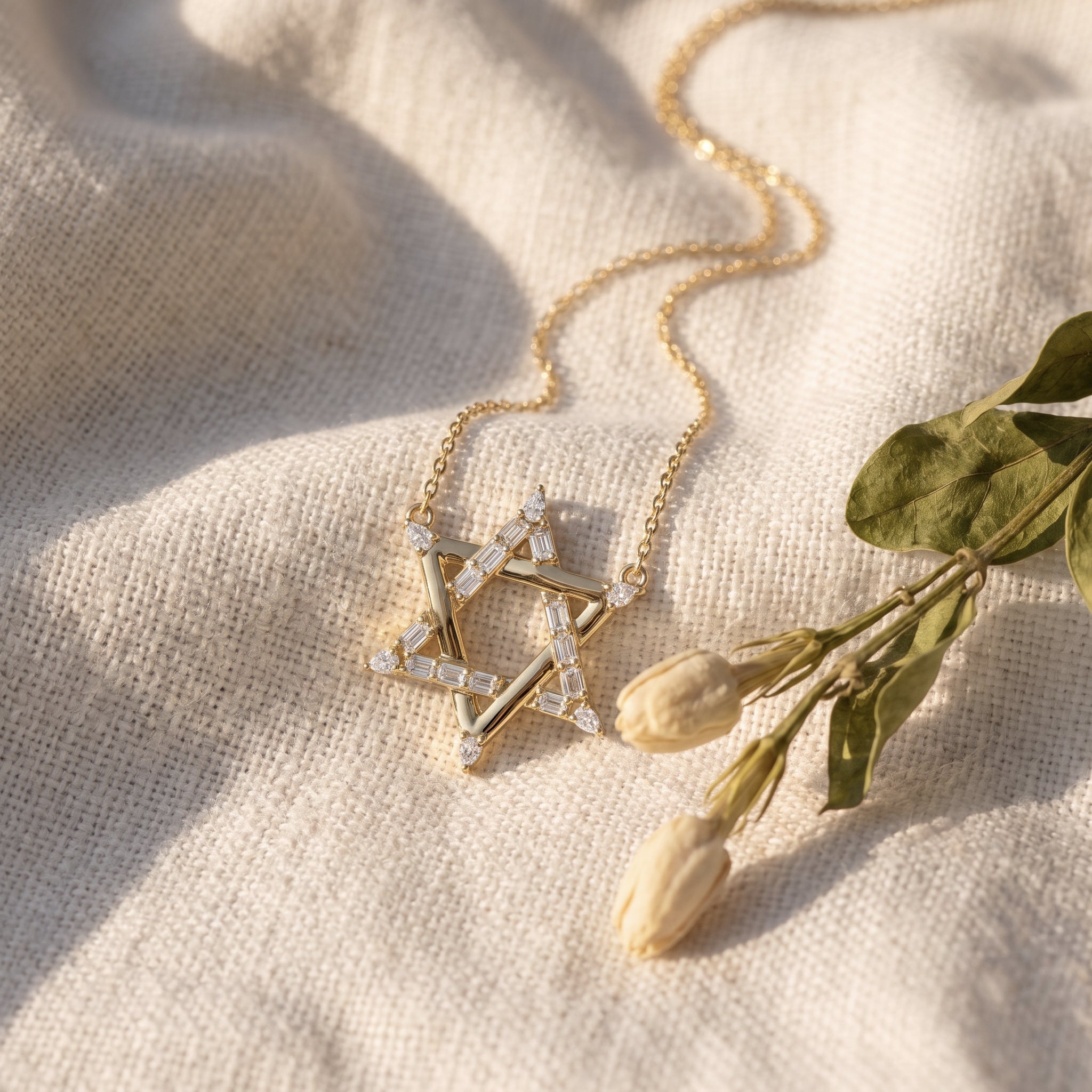 Sarah's Shield pendant on oatmeal linen with dried tulip buds and olive leaves